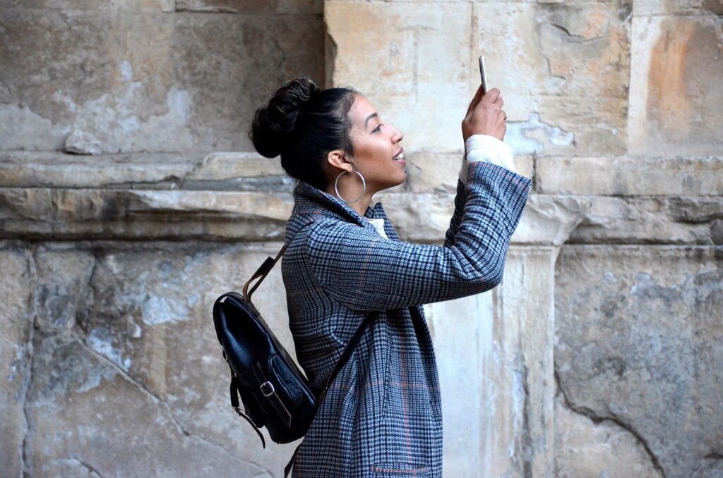 person promoting a place and taking picture of it.