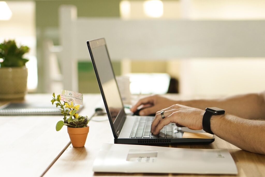 Marketer reading digital marketing trends on laptop